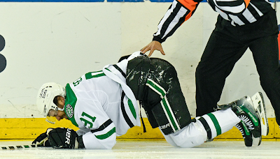 Tyler Seguin on the ice in pain after knee injury